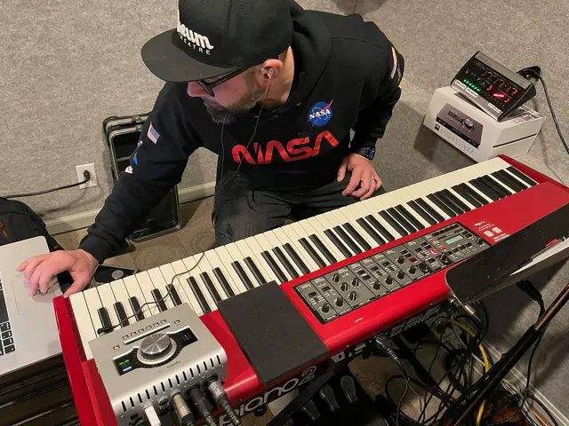 Keyboard player tracking on a red Nord keyboard