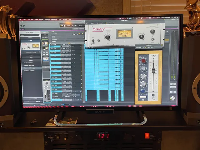 Pro Tools session with Universal Audio plug-ins on the control room screen