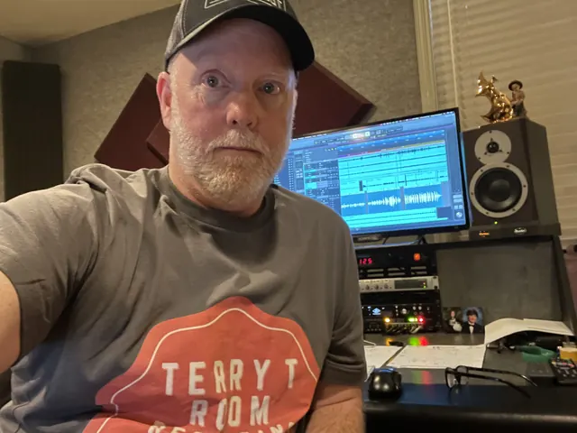 Terry in a Terry T Room shirt in the control room, with Pro Tools on the screen behind him
