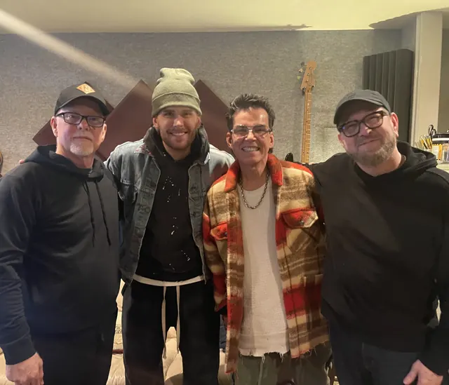 Terry with three musicians in the studio after a session